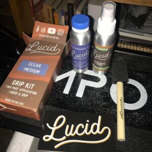 Applying Lucid Clear Liquid Grip Tape on the Apollo Ghost Dual Motor electric scooter. Logo intact.